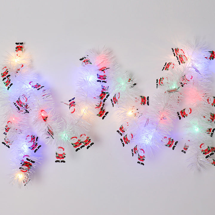 Tinsel Christmas garland with lights and Santas